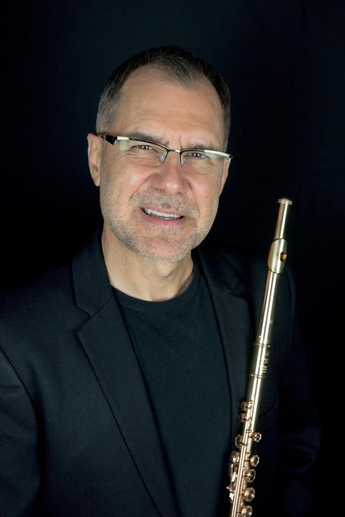 Tadeu Coelho holding a flute